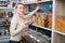 Young woman selected nuts in organic store