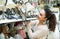 Young woman selecting chandelier