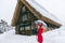 Young woman in Shirakawa-go village in winter, UNESCO world heritage sites, Japan