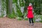 Young woman shivering with cold on a forest