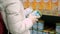 A young woman shopping chooses the goods in the supermarket in the department for children