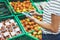 Young woman shopping healthy food in supermarket blur background. Female hands buy nature products using smart phone in store