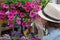 Young woman shopping in an outdoors fresh urban flowers market, buying and picking from a large variety of colorful floral