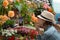 Young woman shopping in an outdoors fresh urban flowers market, buying and picking from a large variety of colorful floral