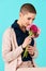 Young woman with short hair smelling bouquet of pink gerbera daisies. Happy Birthday Concept.