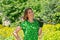 Young woman with a shovel in her hands, gardening in her garden. The concept of summer gardening. Close up