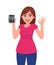 Young woman showing, holding calculator and making okay, OK sign. Trendy girl gesturing cool symbol with hand fingers.