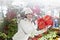 Young woman shows her gift packs inside a Christmas shop