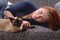 Young woman with siamese cat