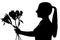 Young woman silhouette giving flowers