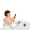 Young Woman Sits at Desk with Smartphone