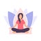 A young woman sits in a padmasana pose and meditates