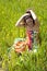 Young woman sitted in a field of flowers.