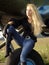 Young woman sitting on airplane landing gear