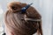 Young woman sitting in beauty hair salon style and waiting for hairdresser to make hairdo