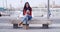 Young woman sitting on a bench in town