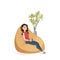 Young Woman Sitting Calm in Brown Beanbag Chair