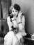Young woman sitting on a chair holding a telephone