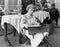 Young woman sitting on a chair and reading documents