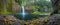 Young woman sitting on the rock at Beautiful waterfall of Abiqua Creek, Abiqua Falls, Oregon, USA.