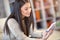 Young woman sitting on a sofa and send text messages