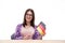 Young woman sitting at the table with German flag