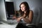 Young woman sitting and working on a computer