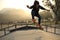 Young woman skateboarder skateboarding at skatepark