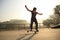 Young woman skateboarder skateboarding at skatepark