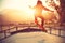 Young woman skateboarder skateboarding at skatepark