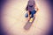 Young woman skateboarder tying shoelace