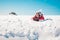 Young woman skier enjoying the snow sunbathing