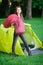 A young woman sleeping bags in a tent while camping.