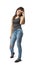 Young woman in sleeveless gray top and blue jeans standing and looking down with hand raised to forehead isolated on