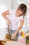 Young woman slicing pineapple