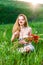 Young Woman smelling poppy, bouquet