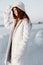 young woman smile Winter mood walk white coat nature