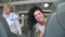 Young woman smiles to camera training on treadmill