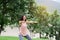 Young Woman Smiling exercising at the park. Healthy Lifestyle concept