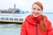 Young woman smiling sea and liner or ferry on the background