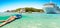 Young woman snorkeling next to tropical island