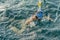 Young woman snorkeling in transparent shallow. Young woman at snorkeling in the tropical water. active woman free diving