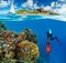 Young woman snorkling next to tropical island