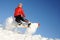 Young woman on the snowboard jumping