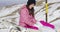 Young woman with snowboard in mountains