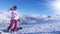 Young woman snowboarder in mountains