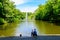 Young woman with son looking on lake with Snake Fountain in Sofiyivka park in Uman, Ukraine