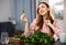 Young woman sorts fresh spinach