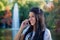 Young woman speaking on the phone in the park