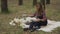Young woman is spending time with the dog in forest